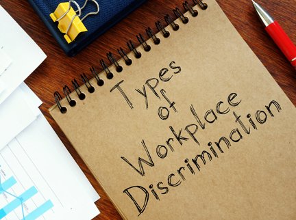 Photo showing a manila folder that has "Types of Workplace Discrimination" written on it