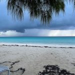 Photo of a rainstorm offshore on a beach